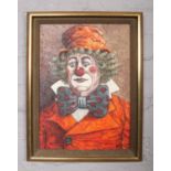 A framed oil on board, portrait of a clown, signed Durham. (41cm x 30cm).