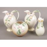 Four pieces of Franz porcelain, to include two jugs and two vases. Chip to the rim of the vase. No