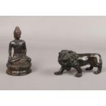 A Bronze seated Budda (approx 13 cm height) & Bronze Lion ( approx 8 cm height)