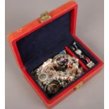 A jewellery case of costume jewellery to include rings, beads, bangles, brooches etc.