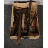 A box of hand tools to include mallet, small pick axe etc.