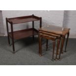 A mahogany nest of three tables, along with a mahogany two tier tea trolley.