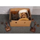 A box of wooden items to include bowling pins, barley twist candlesticks, etc.