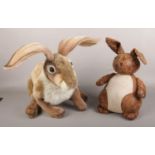 An English Heritage Hansa hare soft toy, along with a rabbit doorstop.