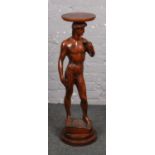 A carved wooden plant stand after Michaelangelo David (approx 96 cm height)