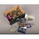 A box of British pre decimal and world coins, to include commemorative crowns, Victorian etc.