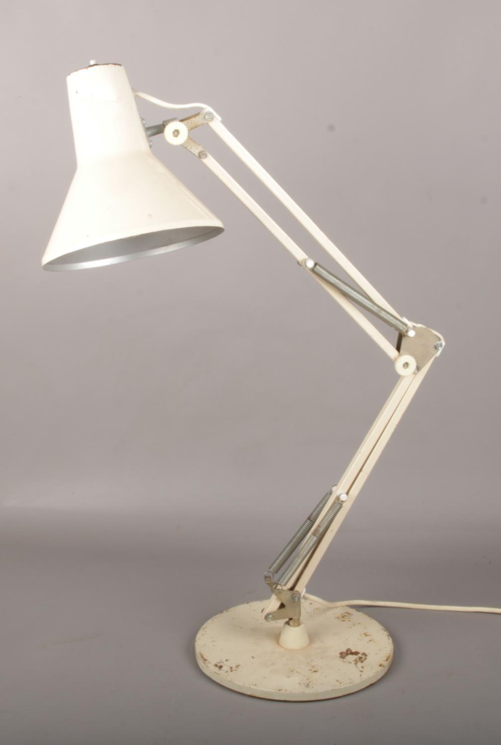 A vintage cream anglepoise desk lamp.