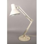 A vintage cream anglepoise desk lamp.