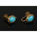 A pair of 9ct gold turquoise stud earrings of ovoid cabochon form.