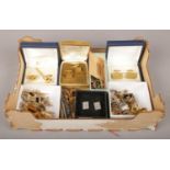 A box of miscellaneous cuff links, tie pins, studs etc.