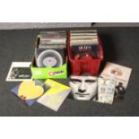 Two boxes of LP records and 12 inch singles, to include Queen, Paul Young, Phil Collins etc.