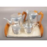 A four part Picquot ware teaset on tray.