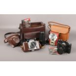 A collection of vintage cameras, Asahi Pentax S1 with Helios 200 mm lens and flash 38mm in bag,