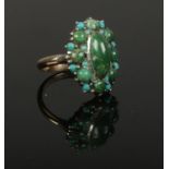 A large 9ct gold and silver turquoise cluster ring, size O.