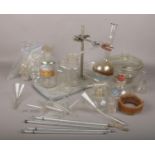 A box of laboratory glassware, test tubes, boiling flasks, storage bottles, thermometers and a lab