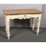A Victorian pine scrub top side table. With single drawer and raised on painted base with turned