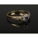 An 18ct gold, sapphire and diamond cluster ring.. Tests as 18ct, marks illegible, size Z+2.