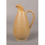 A 19th century Doulton Lambeth salt glazed stoneware ewer. with reeded strap handle and rouletted