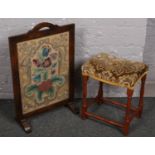 A oak framed tapestry fire screen along with a upholstered piano stool.