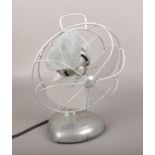 A vintage H Frost & Co electric fan.