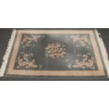 A Chinese pale green silk rug with dragon design (approx 182 cm x 123 cm)