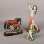 A collection of porcelain figurines, Capodimonte dancing lady, The Leonardo collection horse and