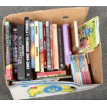 A box of mostly modern children's books.