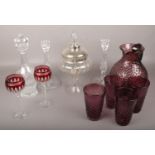 A collection of glassware to include coloured glass lemonade set, cranberry glass waterford glasses,