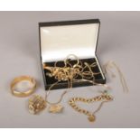 A collection of gold plated costume jewellery, necklaces, brooches, bangle, stamped Grosse, Monet,