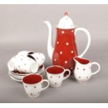 A Susie Cooper bone china coffee set with polka dot design.