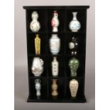 A display of miniature ceramic vases.