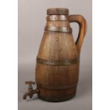 A 19th century oak coopered tavern spirit barrel of ewer form, 32cm.