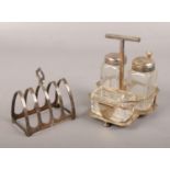 A George VI five bar silver toast rack, assayed Sheffield 1940 by Viner's Ltd. along with a
