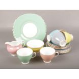 A Colclough bone china multi-coloured tea set. Missing one saucer.