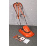 A Flymo Turbo Lite 330 electric hover lawn mower. With instructions and spanner. Used but in