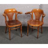 Two 1920s bentwood armchairs with fan patterned seats.