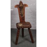 A three legged milking stool ( approx 92 cm height 32 cm wide)