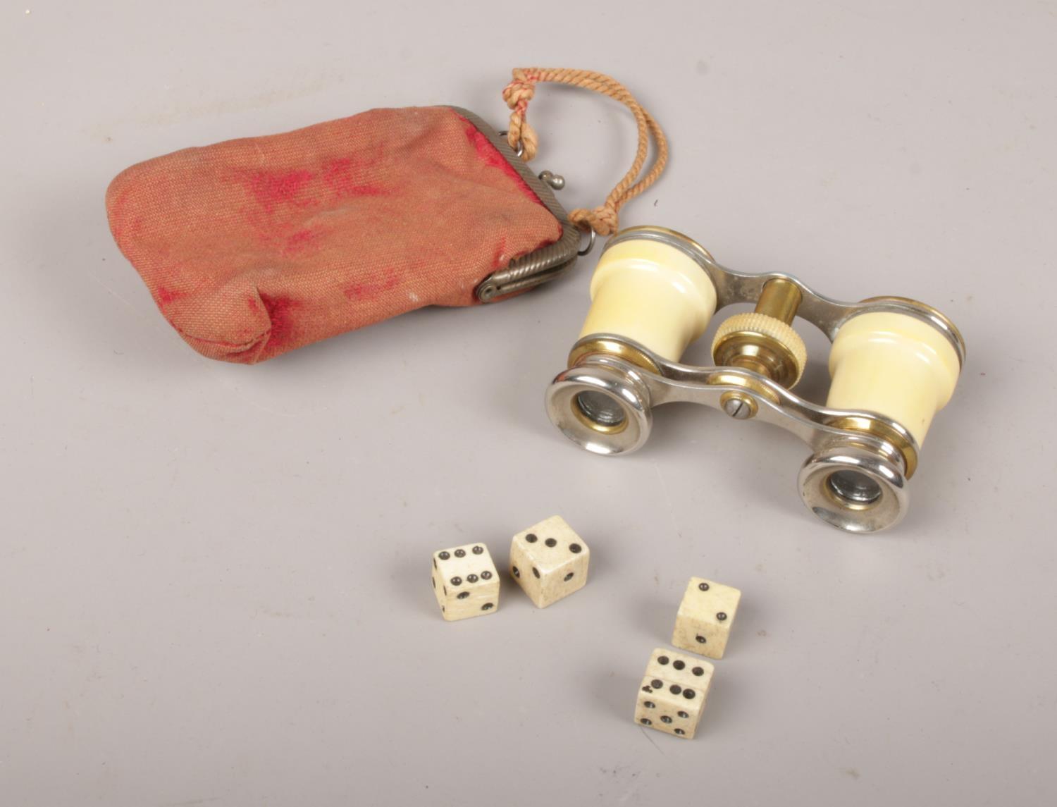Vintage opera glasses with fabric purse to include four bone dice.