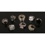 Eight silver dress rings including labradorite, marcasite and onyx examples.