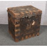 A leather and metal mounted campaign chest, 70cm x 54cm, 74cm high. Mounts perished and pitted. With