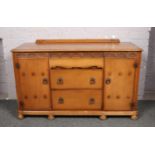 A carved oak sideboard.