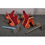 Four vintage yak saddles, two with stands, purportedly removed from Sheffield Bingo Hall in the