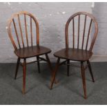 A pair of vintage Ercol spindle back chairs.