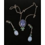 An Art Nouveau style silver mounted stained agate pendant necklet and pair of earrings.