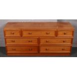 A G-Plan EGomme teak chest of multiple drawers. 150cm x 45cm.