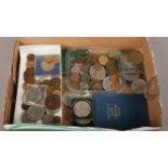 A box of mixed British pre decimal coins. Including cased commemorative crowns, decimal coin set,