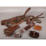 A collection of WWI leather to include gun holster, belt, purses etc.