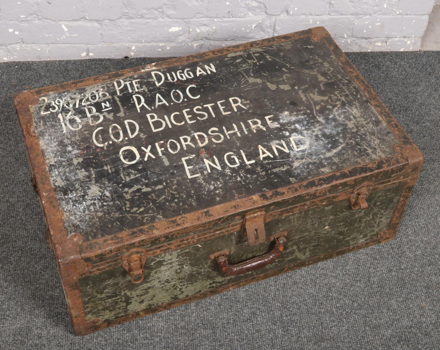 A military trunk with soldiers particulars inscribed and containing a collection of vintage ice