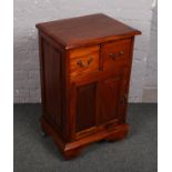 A mahogany side cupboard with two drawers by Ancient Mariner.