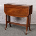 A Victorian mahogany Sutherland table. With strung inlay and banded in satinwood.